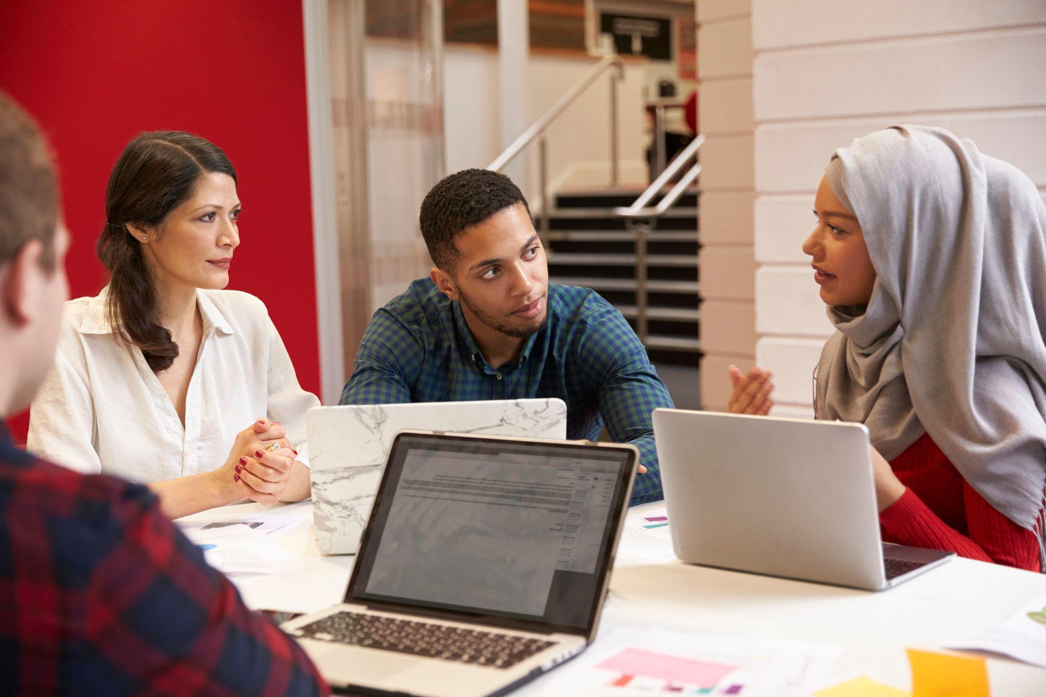 students discussing at table