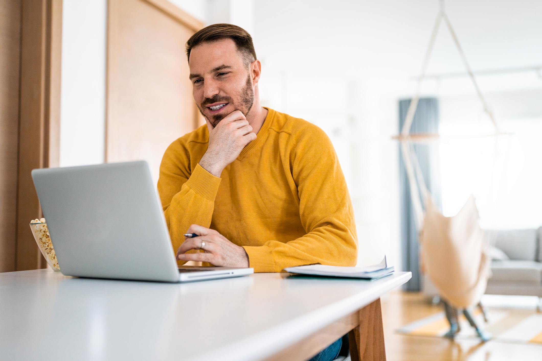 man looking at laptop