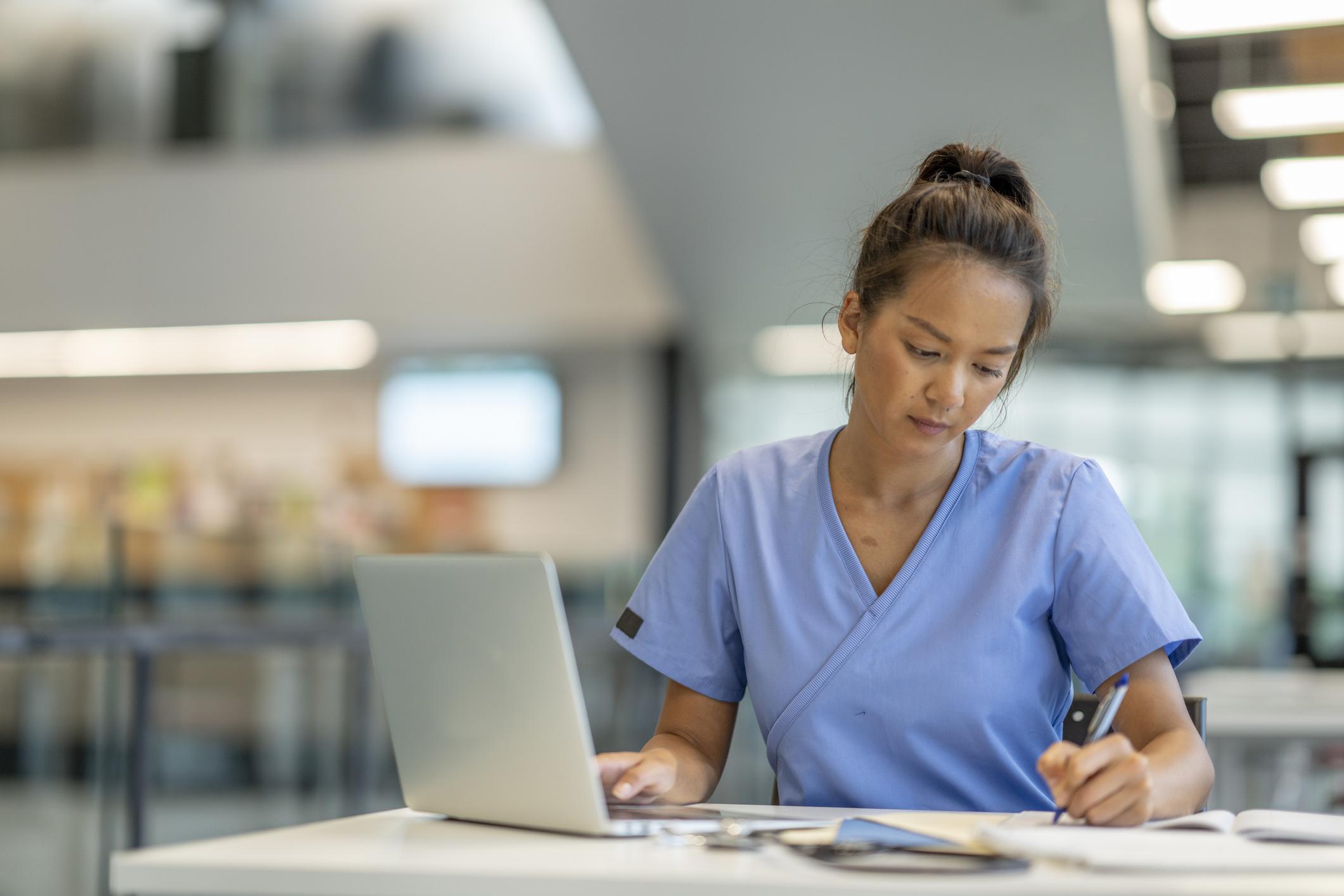 nurse studying at a desk